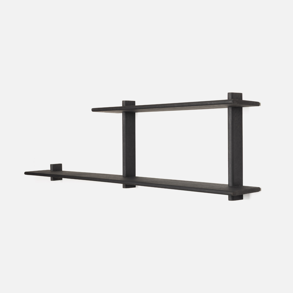 Black wall-mounted shelf on a white background