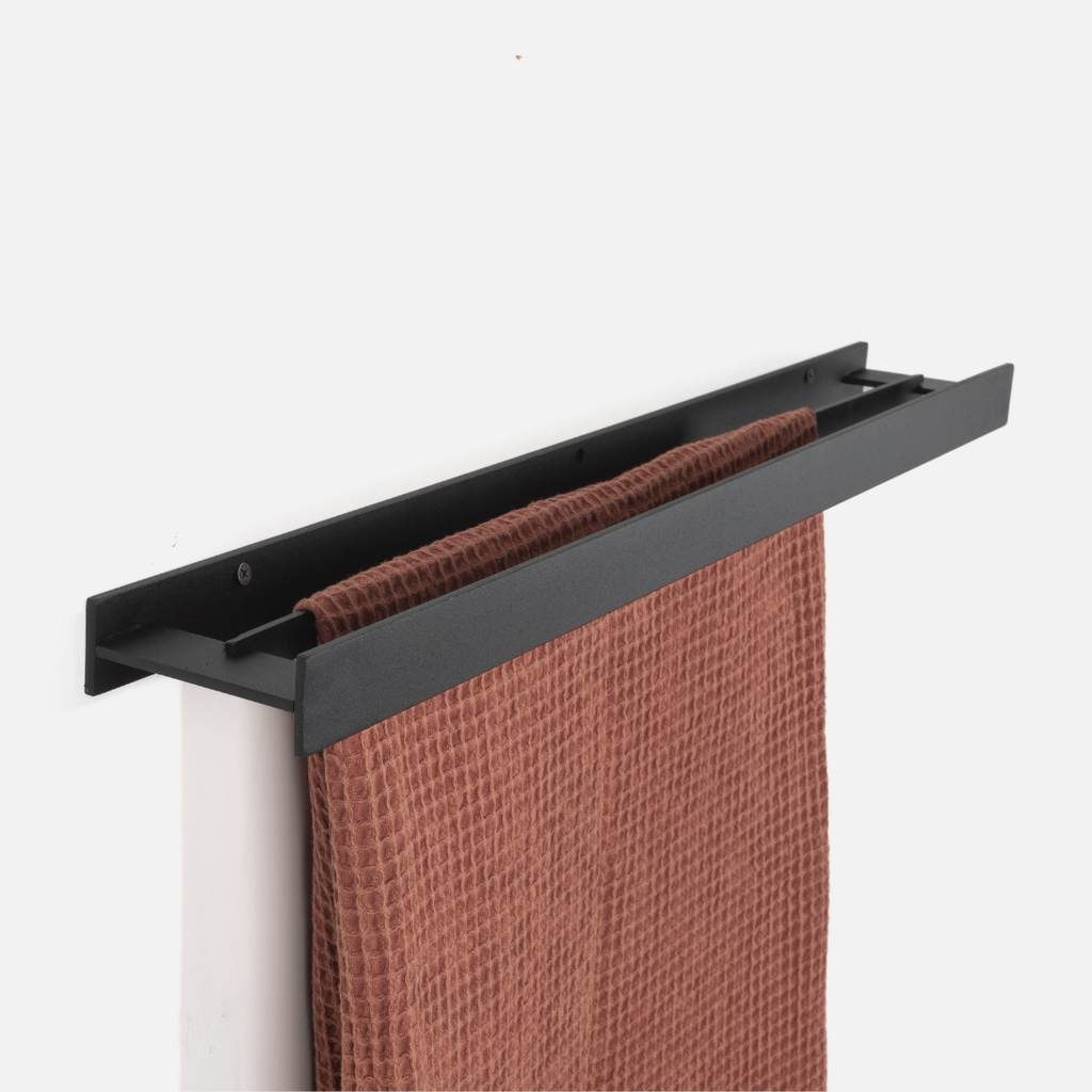 Black metal twin towel holder on a white background
